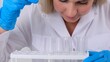 © Евгения Медведева - Close up research chemist takes samples for research and works in a laboratory with a micropipette and a microscope.