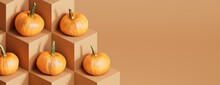Seasonal Background Background With Copy-space. Pumpkins On Warm Brown Color Cubes. Fall Concept.