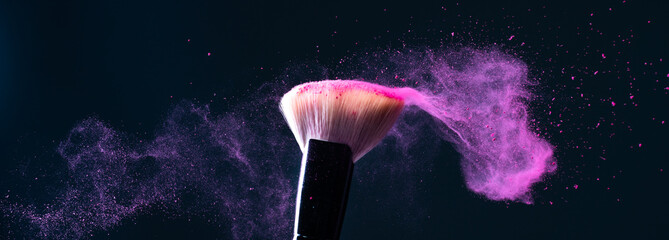 Colored makeup powder on black background