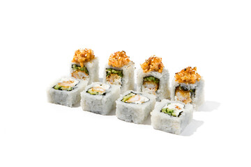 Canvas Print - Maki sushi with rice outside, tempura shrimp inside topped salmon tartare. Shrimp and salmon maki roll isolated on white background Trendy sushi roll with burnt salmon fish and hard shadows