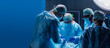 © Acronym - Diverse team of professional medical surgeons perform surgery in the operating room using high-tech equipment. Doctors work to save a patient in a modern hospital. Medicine, technology and healthcare.