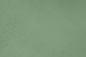 Saturated pastel warm gray green colored low contrast Concrete textured background. Empty colourful wall texture with copy space for text overlay and mockups. 2023, 2024 color trend