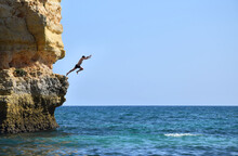 Man Jumping Into The Sea
