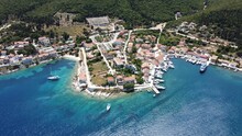 Aerial Drone View Of Nidri City At The Coast Of A Sea In Lefkada Island, Greece