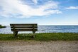 Wooden bench on the shore of a lake in Kingsville, Ontario