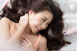 © Shutter B - Top view of Portrait happy young asian woman with beauty products clean fresh bare skin concept. Asian girl beauty face skincare and health wellness, Facial treatment, Perfect skin.
