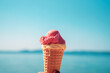 Ice cream in a cone on the background of the sea