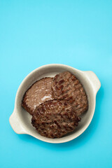 Wall Mural - three fried ground meat in light brown bowl