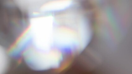 Wall Mural - Rainbow Flicker and Sunny Bokeh. Loop. The light passes through the facets of a slowly rotating diamond and creates repetitive sparkling highlights and rainbow colors