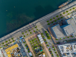 Drone View of City Skyline with Modern Eco-Friendly Energy Renewable Plant. Street with e cars in nice weather.