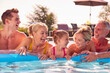 © Monkey Business - Smiling Multi-Generation Family On Summer Holiday Relaxing In Swimming Pool On Airbed