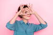 © deagreez - Portrait of adorable nice person arms fingers demonstrate heart symbol eye isolated on pink color background