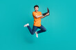 © deagreez - Full size photo of jumping guy using netbook impressed e commerce web discount isolated on cyan color background