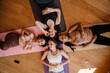 © Drobot Dean - Young multiracial women laughing together during yoga class