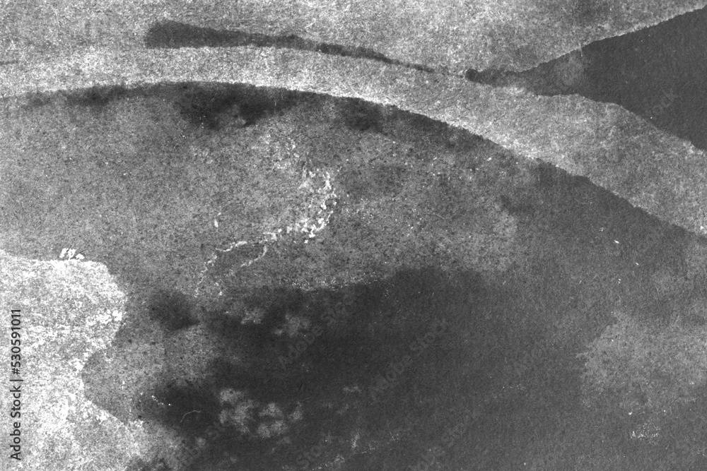 black and white texture of old paper with water stains as a background ...