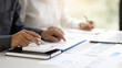 © Wasan - Business Marketing Strategy Analysis and Investment Planning. Business adviser meeting to discuss the situation on the financial report. Financial advisor and accounting concept.