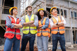 © SKW - group civil engineers male female discuss inspect construction of houses in the village who responsible for exterior work build houses according standards to strong correct according designed designs