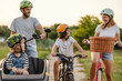 © pikselstock - Happy family cycling together in the countryside