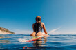 Beautiful girl in sexy swimsuit on surfboard. Water sport lifestyle and summer vacation