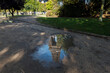 Puddle of water with Eiffel tower reflexion inside