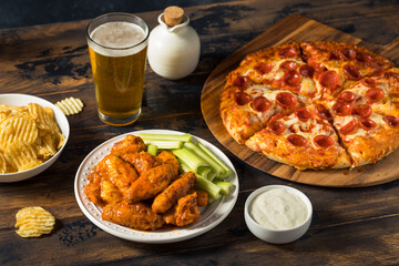 Wall Mural - Homemade Pepperoni Pizza Chicken Wings and Beer