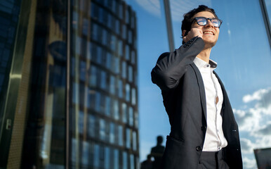 Wall Mural - A businessman man in a formal suit goes to the office to work.