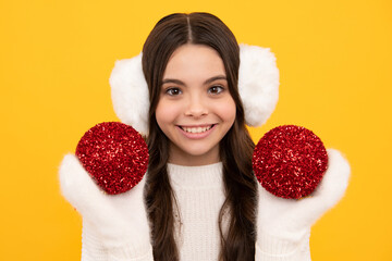 Merry christmas and happy New year. Kid in winter clothes. Teen girl with decorative christmas ball.