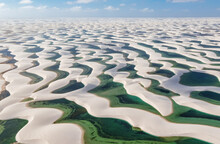 Aerial View Of The  White Sand Dunes Of Lencois Maranhenses With Blue Water Pools