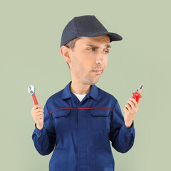 Wall Mural - Funny car mechanic with big head and different tools on color background