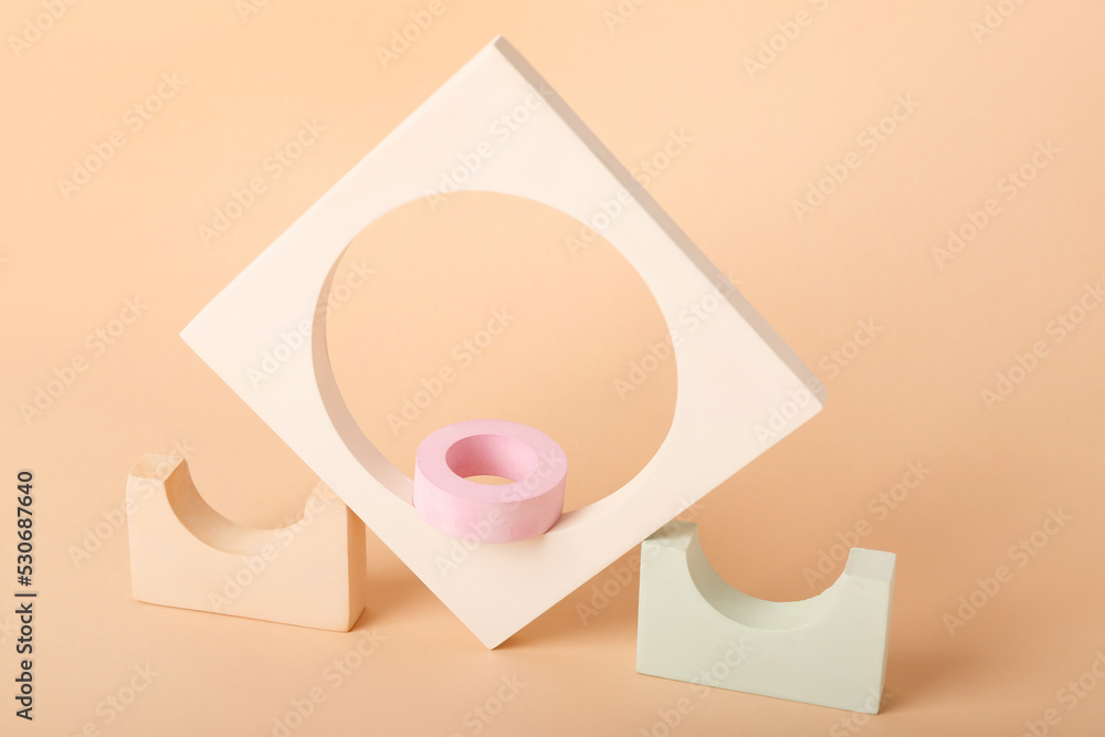 Composition with different showcase pedestals on color background