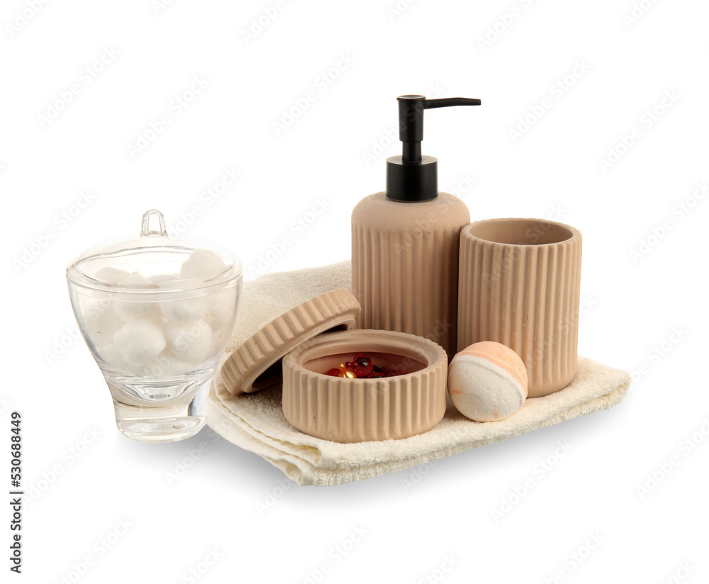 Set of bath accessories with hair capsules on white background
