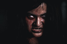 Horror Bloodthirsty Woman Ghost Or Zombie She Is Horror Scary With Open Mouth At Dark Night, Screaming Zombie Female Face With Blood, Happy Halloween Day Festival Concept
