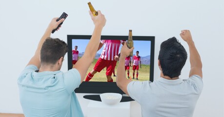 Canvas Print - Composition of two male sports fans watching football match on tv