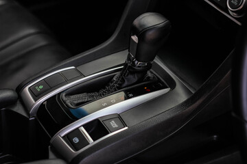 automatic transmission shift selector in the car interior. Closeup a manual shift of modern car gear shifter. 4x4 gear shift	