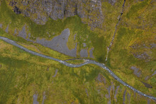 Aerial View Of A River Crossing Anderson Bay Valley, Unalaska, Alaska, United States.