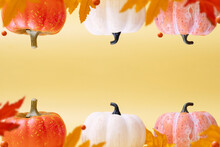 Autumn Pumpkins And Leaves On Warm Background. Levitation Autumn, Halloween Concept. Copy Space.