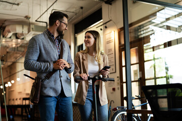 Wall Mural - Business people in office talking. Beautiful businesswoman talking with colleagues..