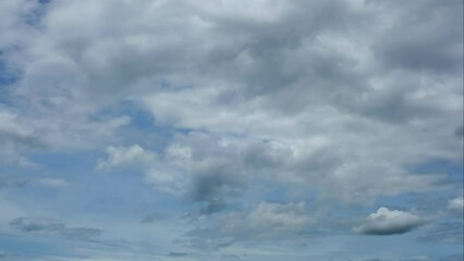 Wall Mural - blue sky white clouds. puffy fluffy white clouds. cumulus cloud cloudscape timelapse. summer blue sk