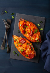 Wall Mural - twice baked sweet potato with cheese and chorizo sausage