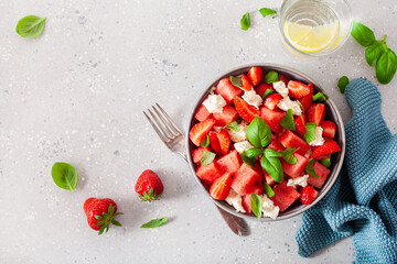 Wall Mural - watermelon salad with strawberry mozzarella cheese basil. healthy summer dessert