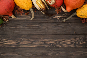 Wall Mural - Background with festive autumn decor from pumpkins, decorative gourds and corn