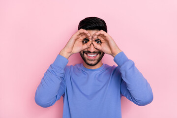 Wall Mural - Photo of funny funky arab guy dressed blue pullover showing arms eyewear isolated pink color background