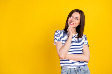 Wall Mural - Photo of pretty cunning girl wear striped outfit arm touch face interested look empty space good idea isolated on yellow color background