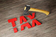 An axe is cutting the letter blocks TAX into halves. Illustration of the concept of tax reduction