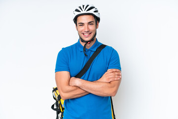 Wall Mural - Young caucasian man with thermal backpack isolated on white background keeping the arms crossed in frontal position