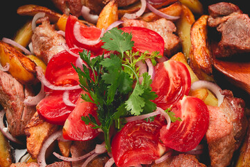 Wall Mural - Ojakhuri, Traditional Georgian dish, fried potatoes with meat, in a clay frying pan, top view, no people, homemade,