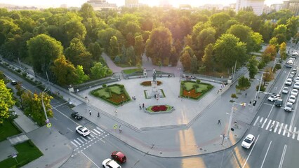 Wall Mural - Aerial drone view of Chisinau downtown at sunset. Park with the Stephen the Great Monument, a lot of greenery, people. Moldova