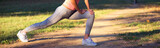 Fototapeta Las - Young sports woman exercise in the summer park on a sunny day