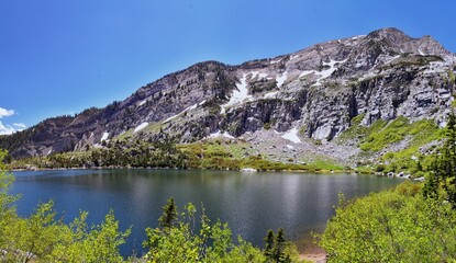 Wall Mural - Silver Lake Flat Reservoir views of fresh water lake and surrounding Mountains above Tibble Fork up American Fork Canyon. Wasatch Mountains, Utah. USA.