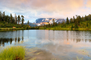 Wall Mural - Mount Shuksan at sunset with reflection view from Picture Lake, Deming Washington.  Picture Lake is the centerpiece of a strikingly beautiful landscape in the Heather Meadows area